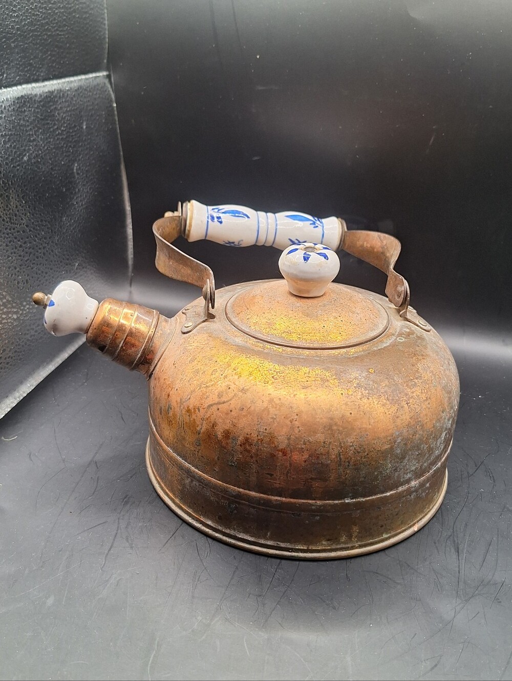 Vintage copper tea pot kettle with a blue and white porcelain handle and knob on